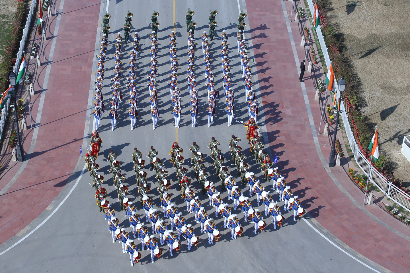 A vibrant Republic Day parade featuring colorful floats representing different states of India, adorned with cultural symbols, flowers, and traditional designs.