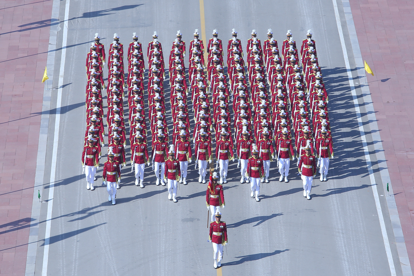 A vibrant Republic Day parade featuring colorful floats representing different states of India, adorned with cultural symbols, flowers, and traditional designs.