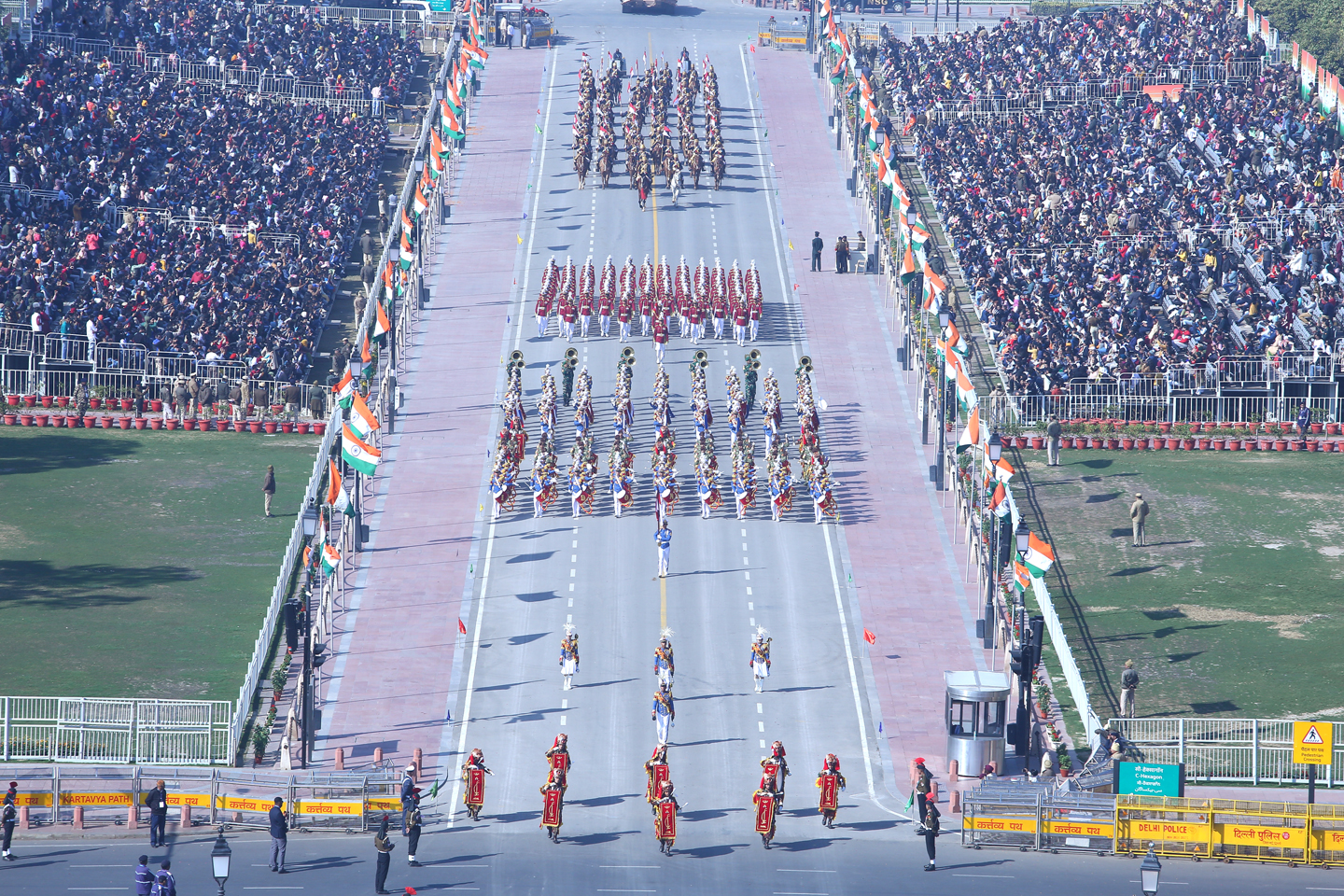 A vibrant Republic Day parade featuring colorful floats representing different states of India, adorned with cultural symbols, flowers, and traditional designs.