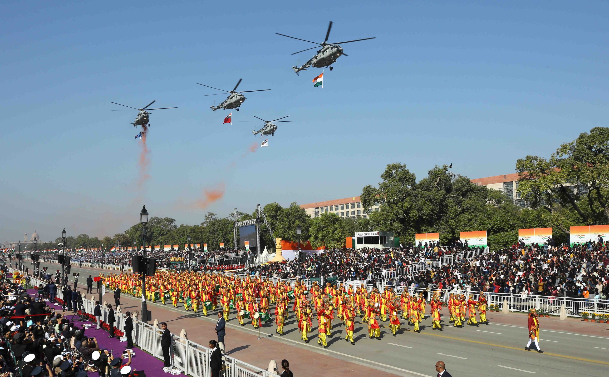 A vibrant Republic Day parade featuring colorful floats representing different states of India, adorned with cultural symbols, flowers, and traditional designs.