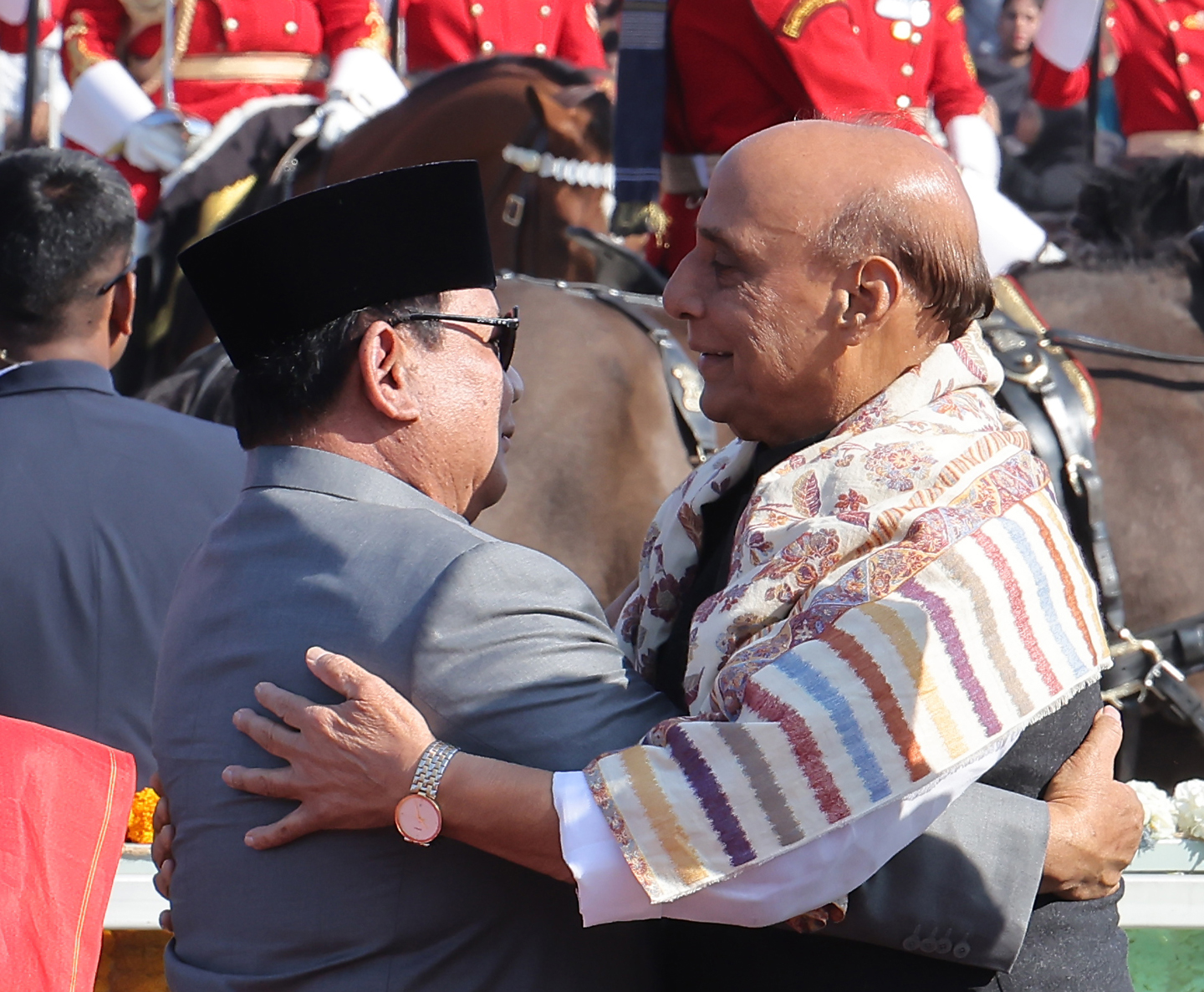A vibrant Republic Day parade featuring colorful floats representing different states of India, adorned with cultural symbols, flowers, and traditional designs.