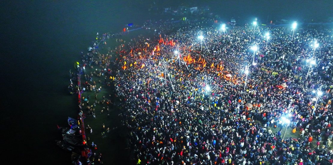 Thousands of devotees immersed in the sacred waters of the Triveni Sangam, performing rituals during the First Amrit Snan of Mahakumbh 2025.